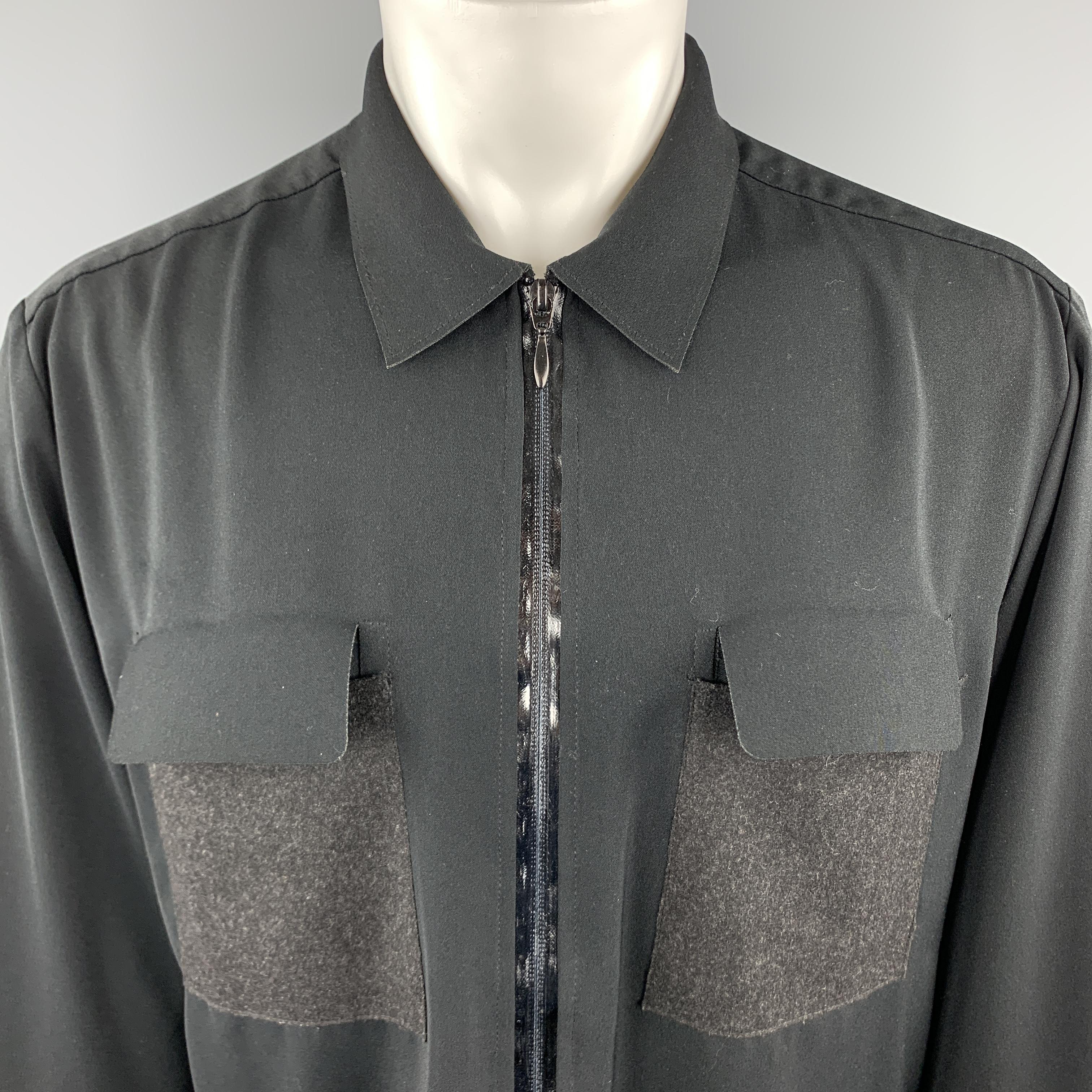 MARITHE+FRANCOIS GIRBAUD lightweight jacket comes in a solid black polyester material, with a zip at closure, textured patch pockets and cuffs, unlined. Made in Italy. 

Excellent Pre-Owned Condition.
Marked: US 36

Measurements:

Shoulder: 19 in.