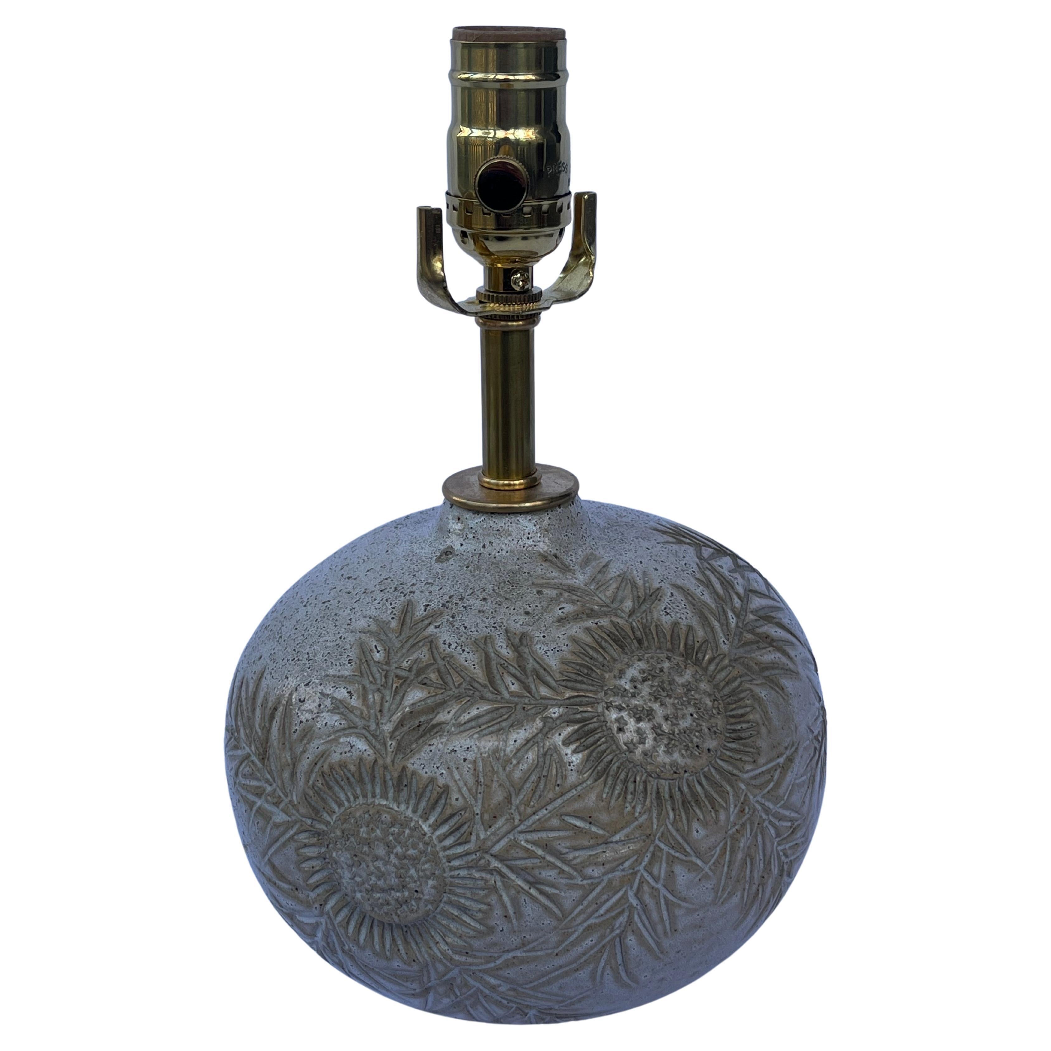 A beautifully crafted ceramic pottery table lamp by French artist Marius Bessone. This pottery vessel has a thistle design. In the Basque region of France, the thistle symbolizes protection and is often hung on a doorway or entryway. The petite