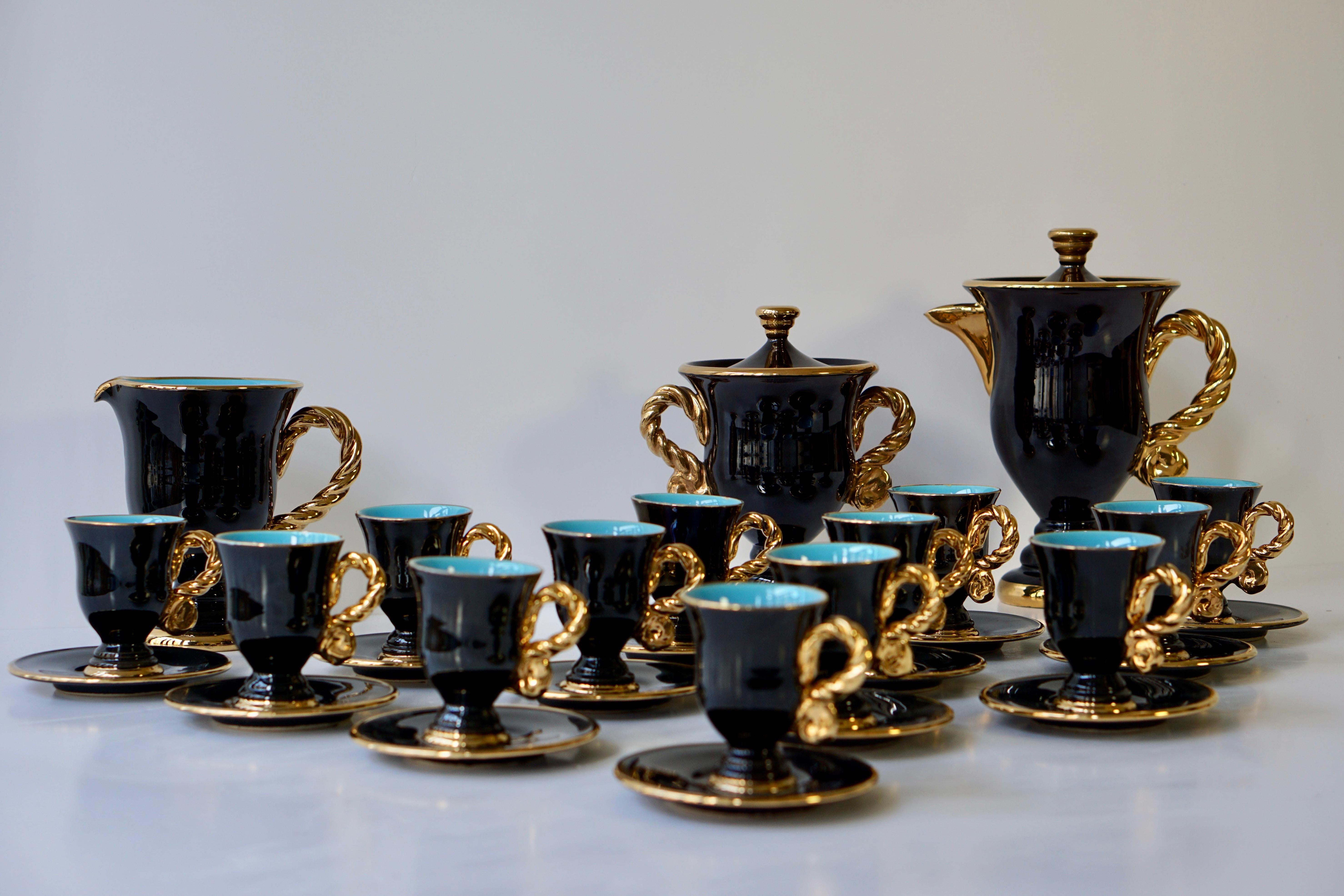 The beautiful set comprised of a tea or coffee pot, a cream jug and a sugar bowl with lid and thirteen cups and saucers, each piece with gilded borders.
Exquisite ceramic, a make prized by collectors the world over.
Coffee pot height 27 cm, width