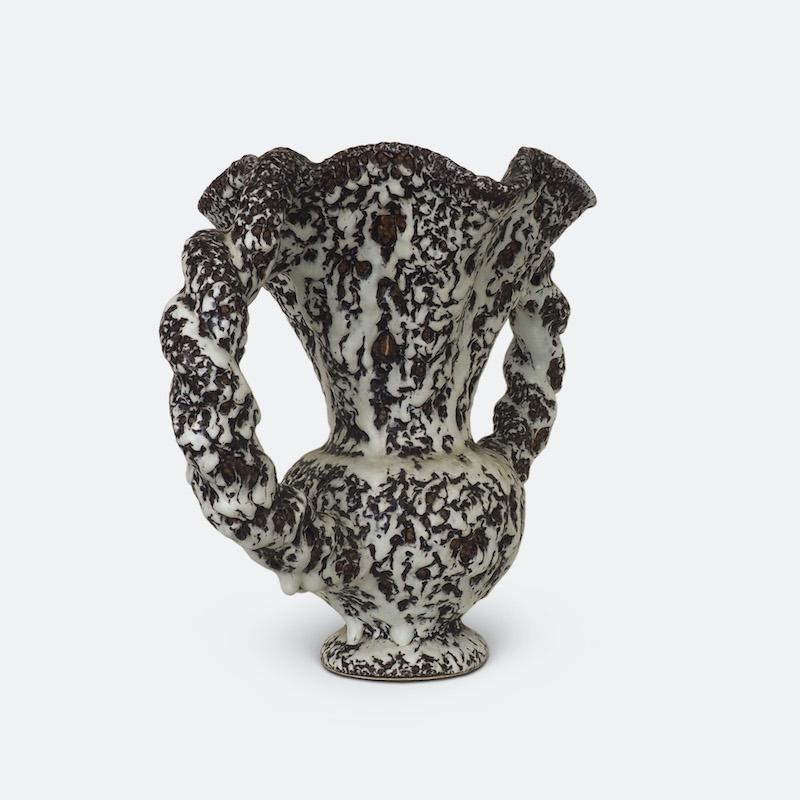 A beautiful 1950s vase made by the legendary French pottery manufacturer Vallauris and designed by Marius Giuge. 
Finished in a textured lava glaze of white over grey with rope style twisted handles. A wonderful mid twentieth century interpretation