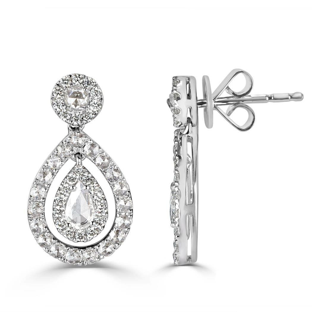 This gorgeous pair of diamond earrings showcases 1.10ct of rose and round brilliant cut diamonds graded at E-F, VS1-VS2. At the center of each drop lies a stunning rose cut pear shape diamond surrounded by round brilliant cut diamonds. The diamonds