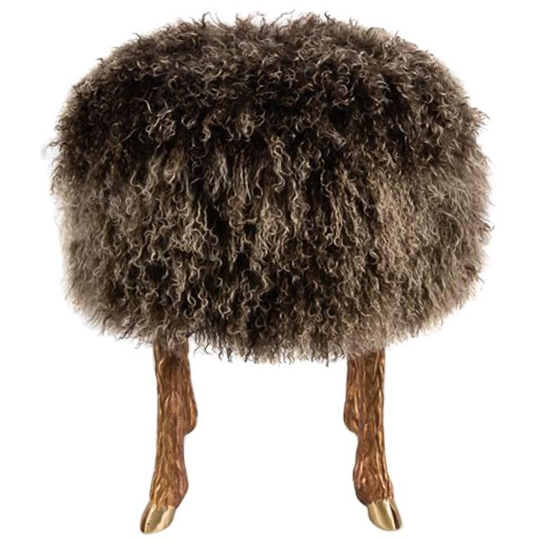 This surrealistic stool, which rests on silver or bronze legs modeled after a goat's, and is upholstered in lamb's wool, is a successful new take on a centuries-old tradition: transforming the pastoral into exceptional, lush decor.

This listing is