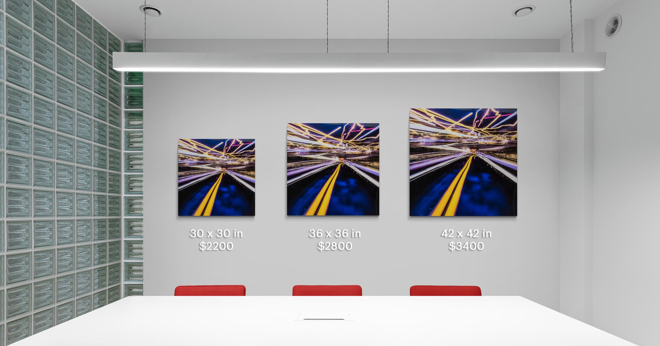 Shocks of light -- yellow , indigo, red and white -- zip through the night in this dynamic photographic print by Mark Bartkiw. This C-print is sealed between dibond and plexiglass. The work weighs 23 lbs. This work is the Artist's Proof from an