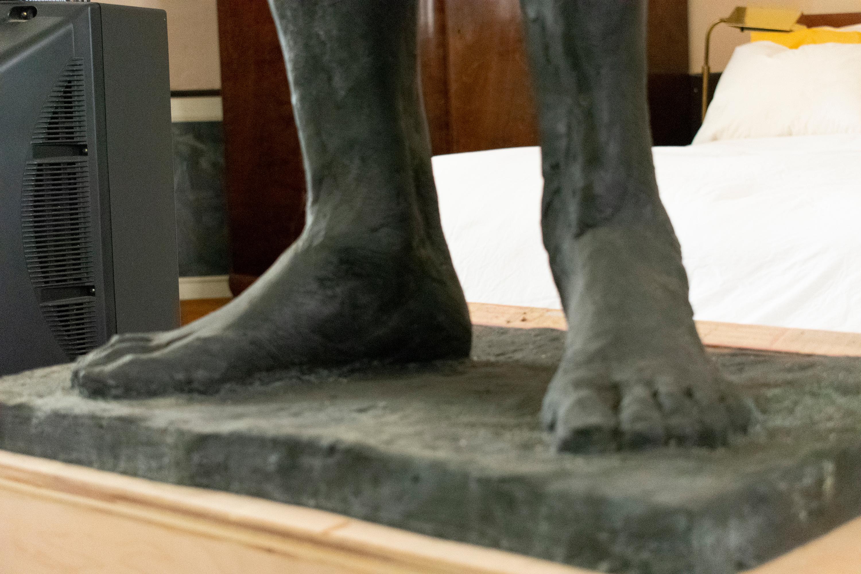 Academic style, figurative bronze sculpture of standing male wrestler in singlet
71 inches x  22 inches x 16 inches
Signature located on base

This academic style sculpture of an athletic male nude stands 71 inches and is 22 inches at it's widest