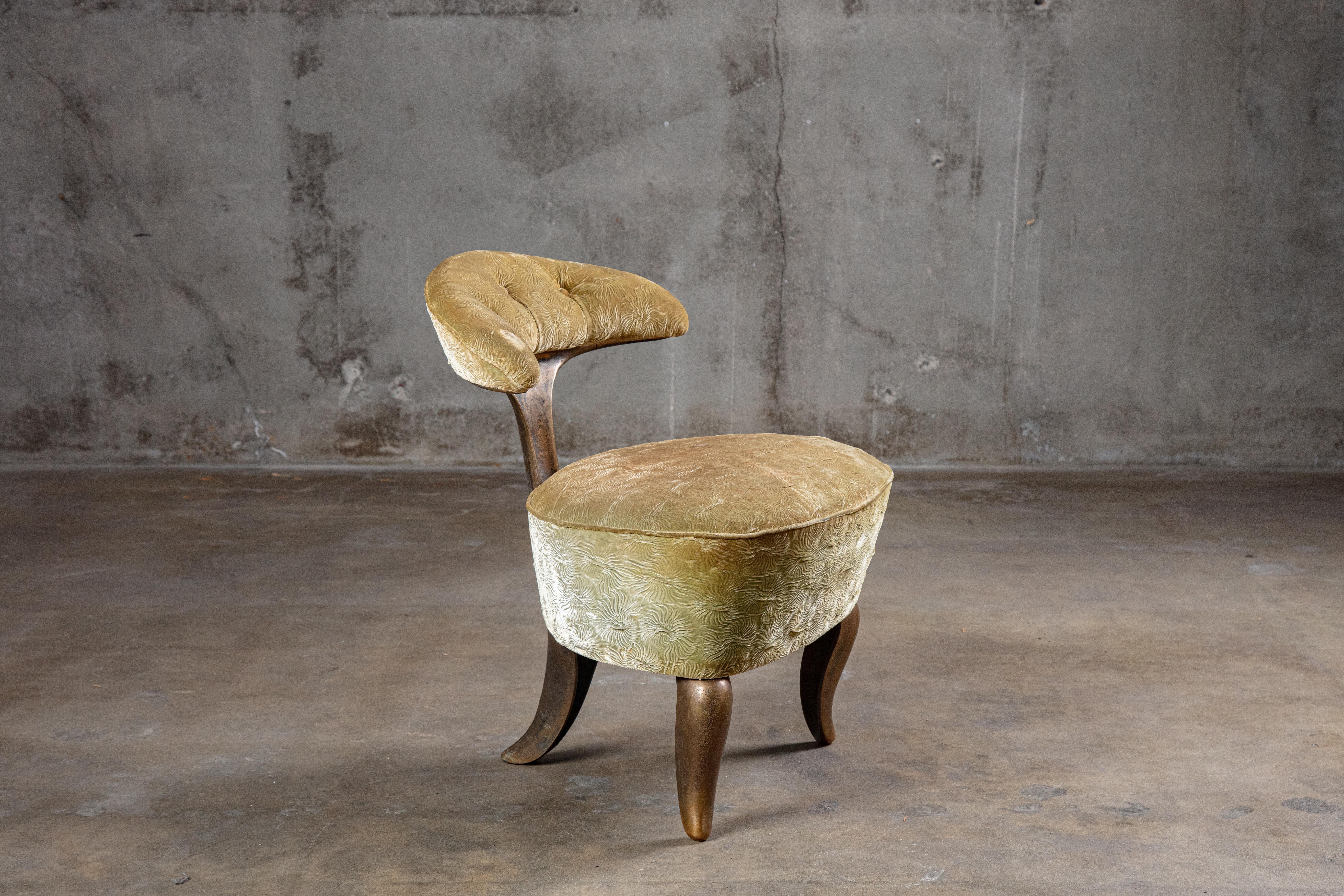Mark Brazier-Jones (born 1956) 'Lunar' chair, designed 1998, in patinated bronze and upholstered in velvet.