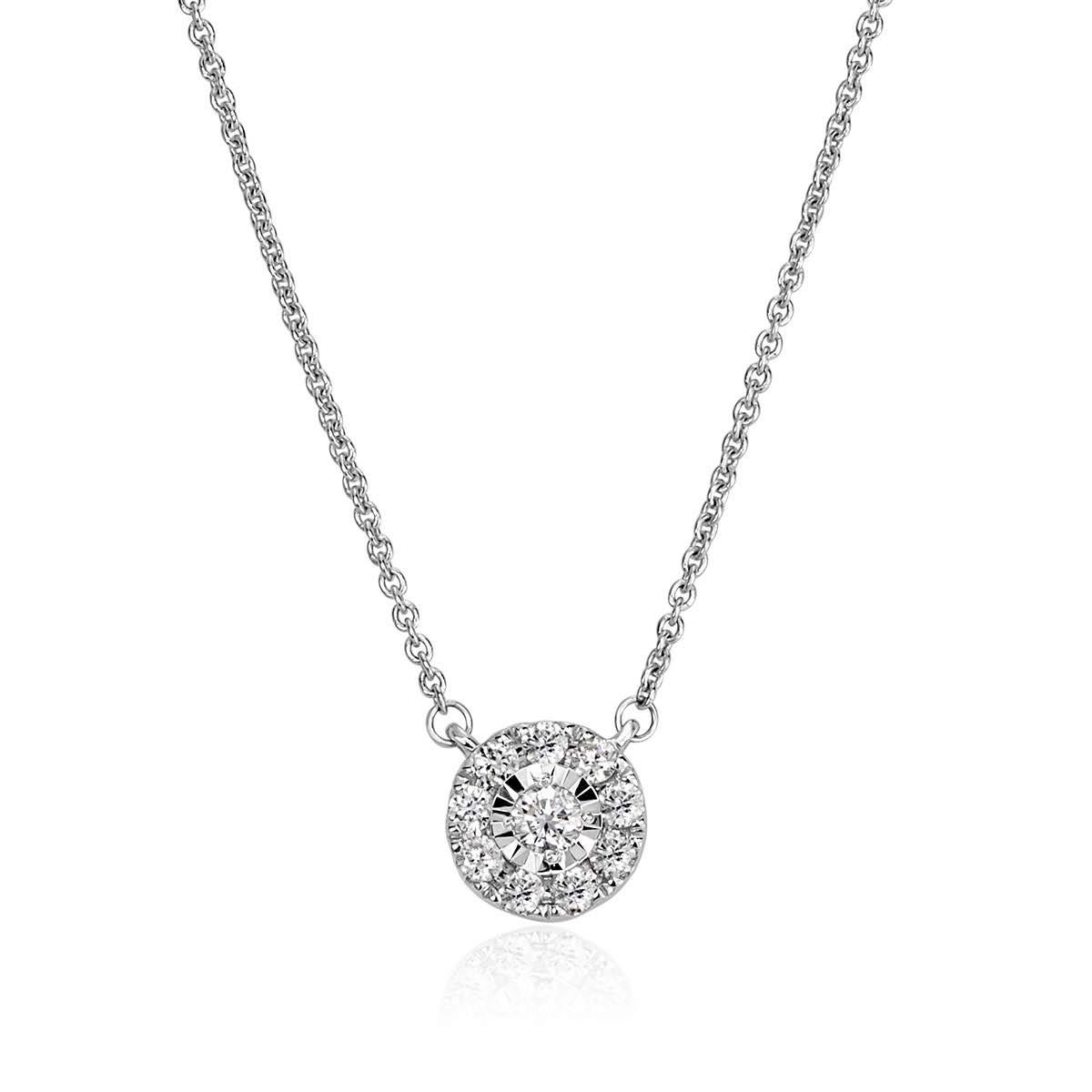 Handcrafted in 14k white gold, this ravishing diamond pendant features 0.19ct of round brilliant cut diamonds micro pavé set in an exquisite floral pattern. The diamonds are graded at E-F in color, VS1-VS2 in clarity.