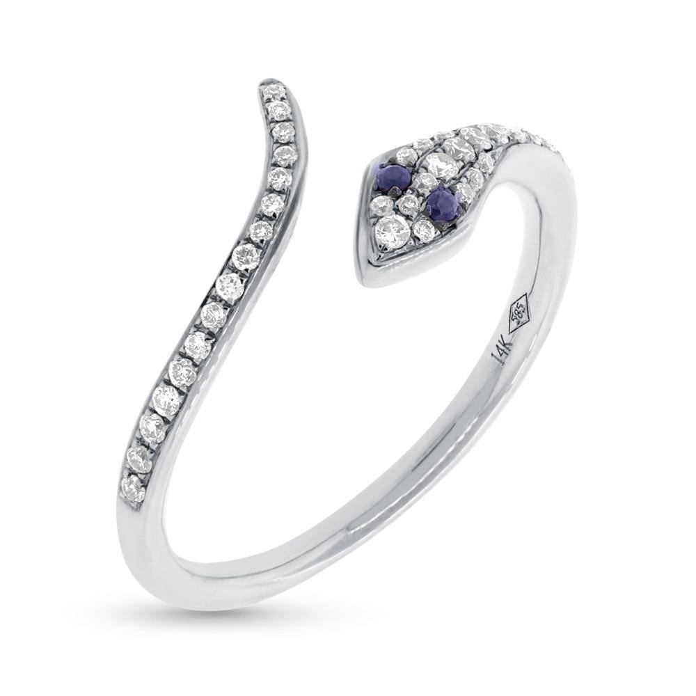 Handcrafted in 14k white gold, this ravaishing snake ring showcases 0.19ct of peerless white round brilliant cut diamonds as well as 0.03ct of blue sapphires. The diamonds are graded at F-G, VS2-SI1.
