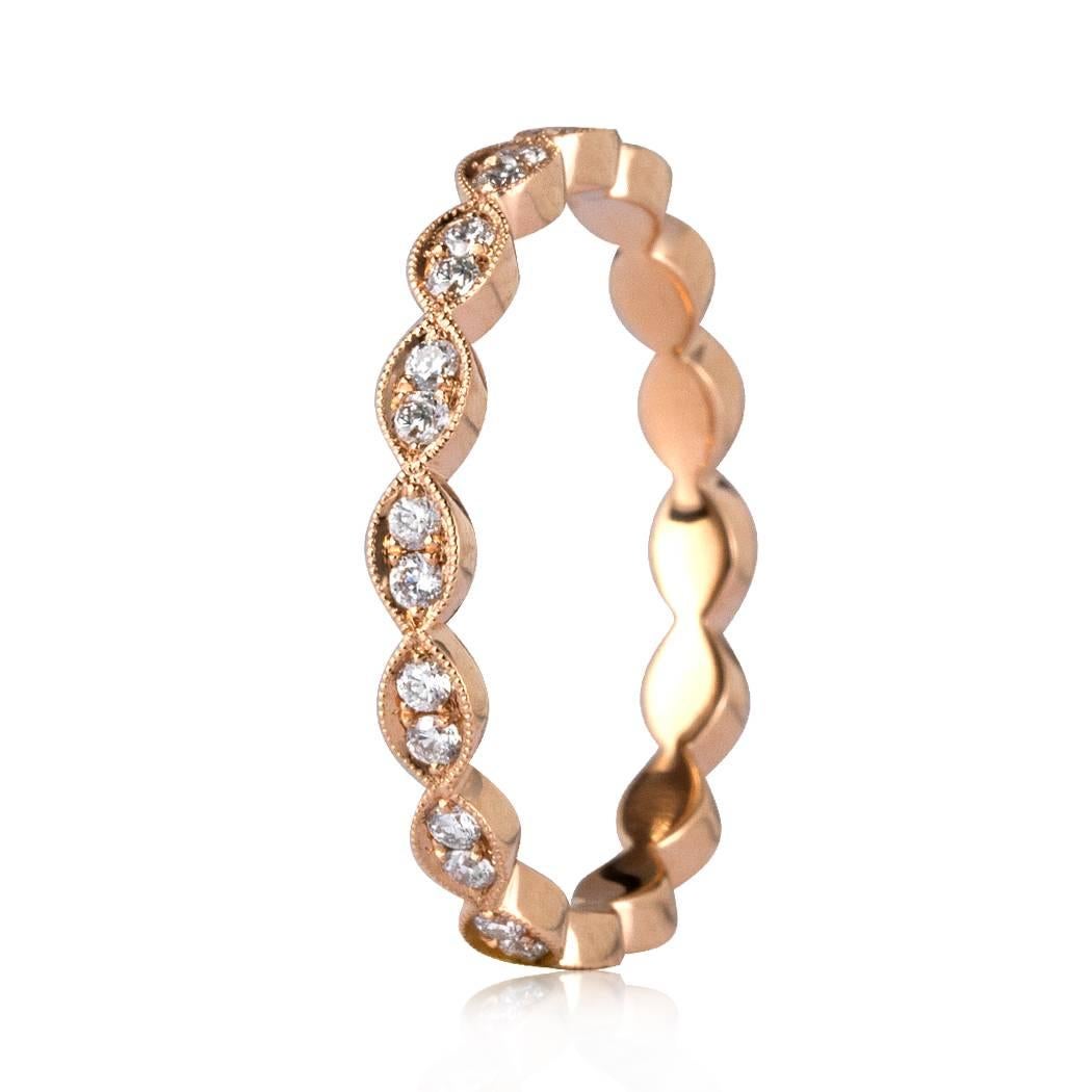 This lovely diamond eternity band showcases 0.35ct of round brilliant cut diamonds pavé set in a scalloped, 18k rose gold custom setting. The diamonds are perfectly matched and graded at E-F, VS1-VS2. All eternity bands are shown in a size 6.5. We
