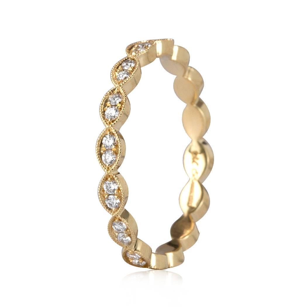 This lovely diamond eternity band features 0.35ct of round brilliant cut diamonds pavé set in 18k yellow gold. The diamonds are graded at E-F in color, VS1-VS2 in clarity. All eternity bands are shown in a size 6.5. We custom craft each eternity