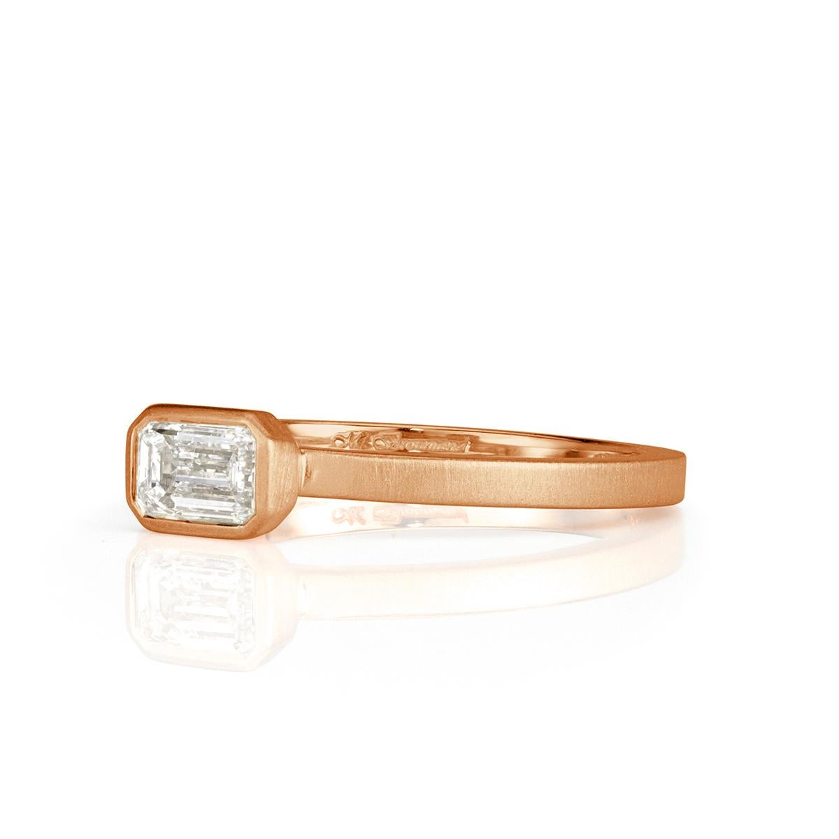 This chic diamond band showcases a beautiful 0.45ct emerald cut center diamond graded at F in color, VS1 in clarity. It is bezel set in a satin finish, 18k rose gold setting style. Absolutely perfect for everyday wear!
