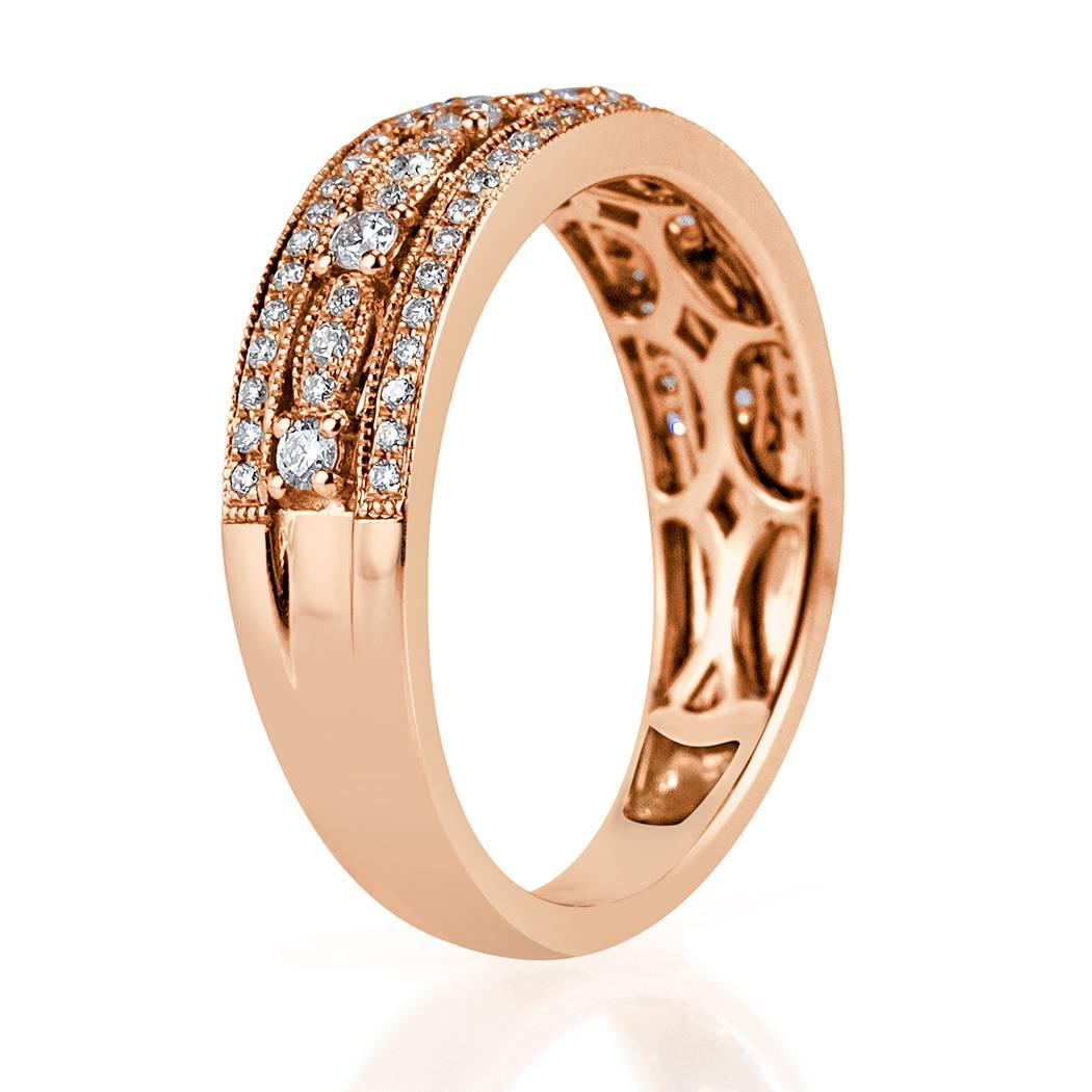 This feminine 14k rose gold diamond ring is set with 0.45ct of perfectly matched round brilliant cut diamonds graded at F-G, VS1-VS2.