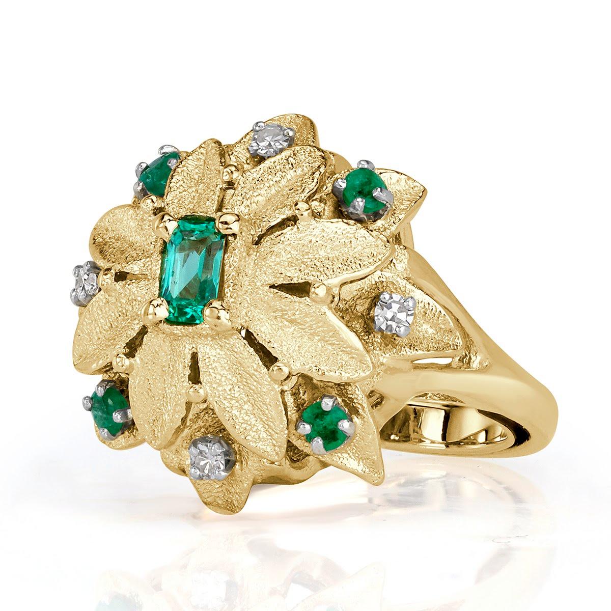 This gorgeous vintage diamond and emerald diamond ring showcases a ravishing floral design studded with 0.48ct of diamonds and green emeralds.( 0.40ct Emeralds + 0.08ct Diamonds )
