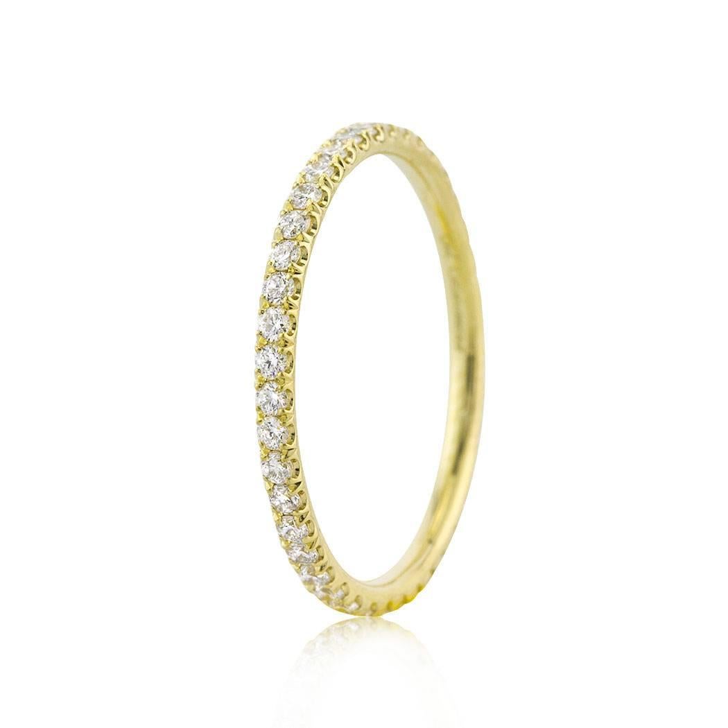This diamond eternity band features 0.50ct of round brilliant cut diamonds graded at E-F, VS1-VS2. They are micro pavé set to perfection in 18k yellow gold. All eternity bands are shown in a size 6.5. We custom craft each eternity band and will