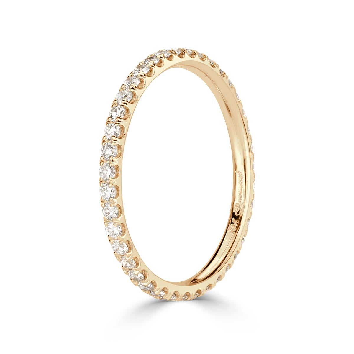 Custom created in our signature 18k champagne yellow gold, this ravishing diamond wedding band showcases 0.50ct of round brilliant cut diamonds graded at top qualities of E-F in color, VS1-VS2 in clarity. Absolutely perfect to wear on its own or to