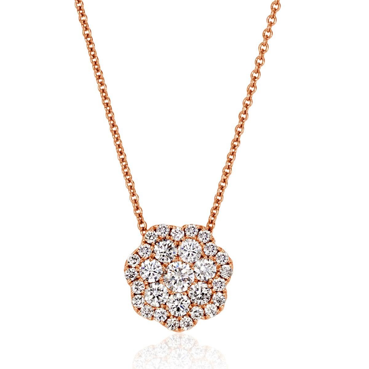 Handcrafted in 14k rose gold, this ravishing diamond pendant features 0.51ct of round brilliant cut diamonds arranged in a charming floral pattern. Each of the diamonds are matched and graded at E-F in color and VS1-VS2 in clarity. It is stunning