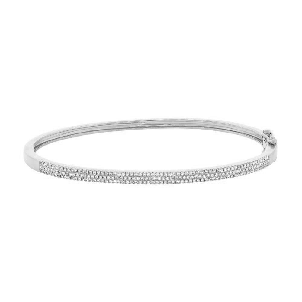 This elegant diamond bangle features three rows of round brilliant cut diamonds hand set in 14k white gold. The diamonds are graded at F-G, VS2-SI1.

