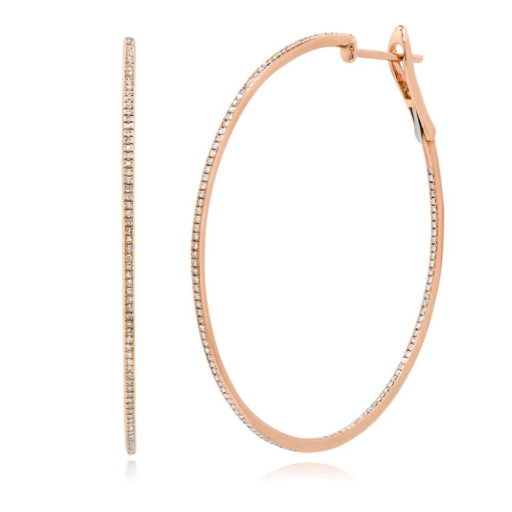 Created in 14k rose gold, this beautiful pair of diamond hoop earrings measures 2
