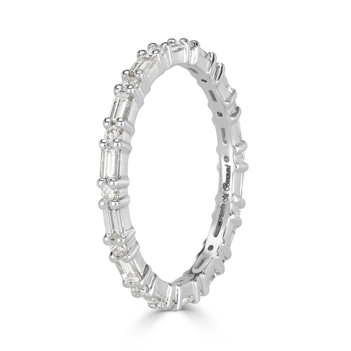 This truly ravishing diamond eternity band features an exquisite design of alternating baguette and round brilliant cut diamonds graded at E-F, VS1-VS2. The diamonds total 0.77ct in weight and are impeccably hand set in high polish platinum. All