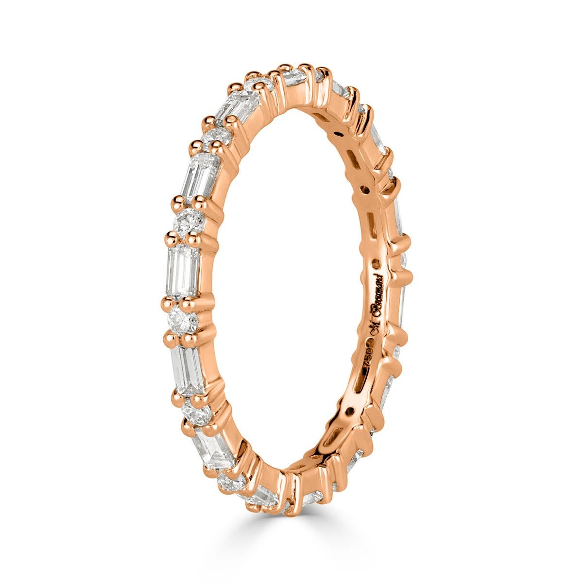 Handcrafted to perfection in 18k rose gold, this stunning diamond eternity band showcases 0.77ct of peerless white round and baguette cut diamonds set in an alternating way. The diamonds are graded at E-F in color, VS1-VS2 in clarity. All eternity