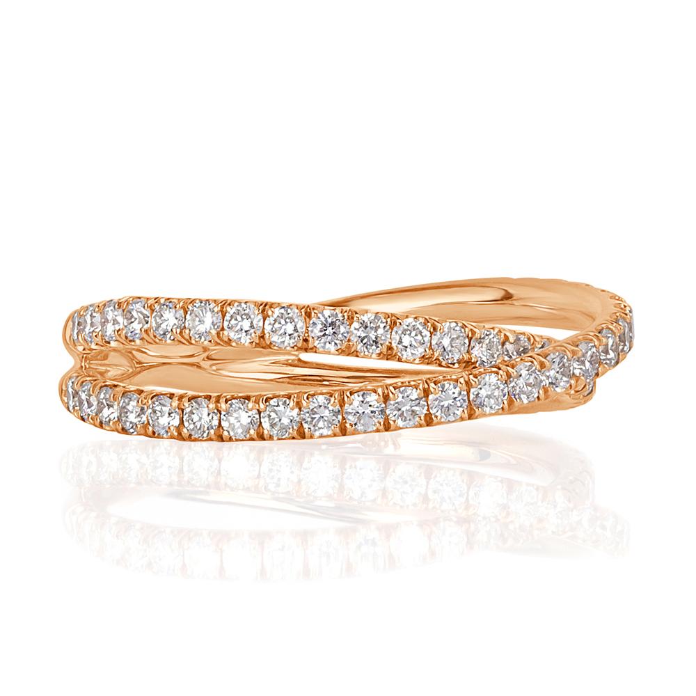 This exquisite crisscross diamond wedding band showcases 0.85ct of round brilliant cut diamonds micro pavé set in 18k rose gold. The diamonds are graded at E-F, VS1-VS2. Truly stunning on it's own or paired with your engagement ring!
