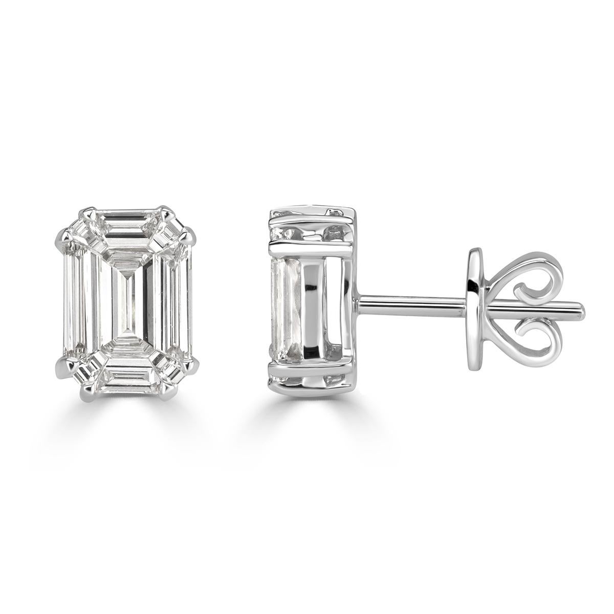 This elegant pair of diamond stud earrings showcases two emerald cut diamonds with a total weight of 0.88ct. They are graded at E-F in color, VS1-VS2 in clarity and measure 7.80 x 5.40mm. They are set in a double prong, 18k white gold setting.
