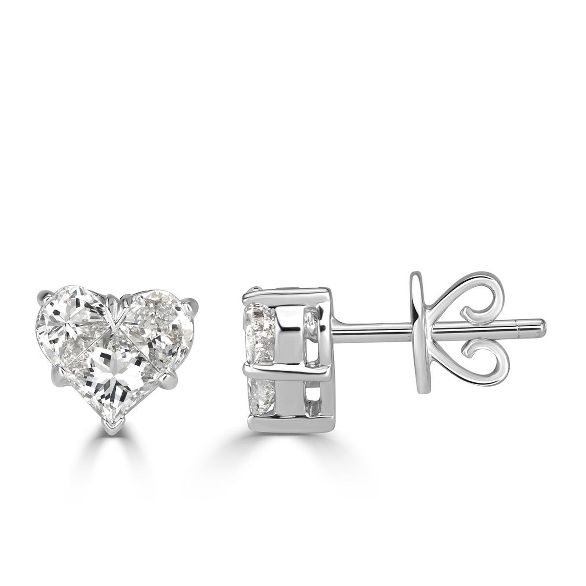 Handcrafted in 18k white gold, this exquisite pair of diamond earrings showcases two heart shaped designs studded with 0.95ct of invisibly set diamonds graded at E-F, VS1-VS2. Absolutely perfect for everyday wear!
