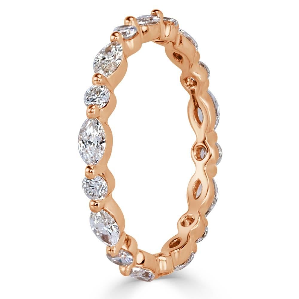 Crafted in 18k rose gold, this exquisite diamond eternity band showcases 1.00ct of marquise and round brilliant cut diamonds graded at E-F, VS1-VS2. They are impeccably matched and set with a single prong for maximum sparkle.