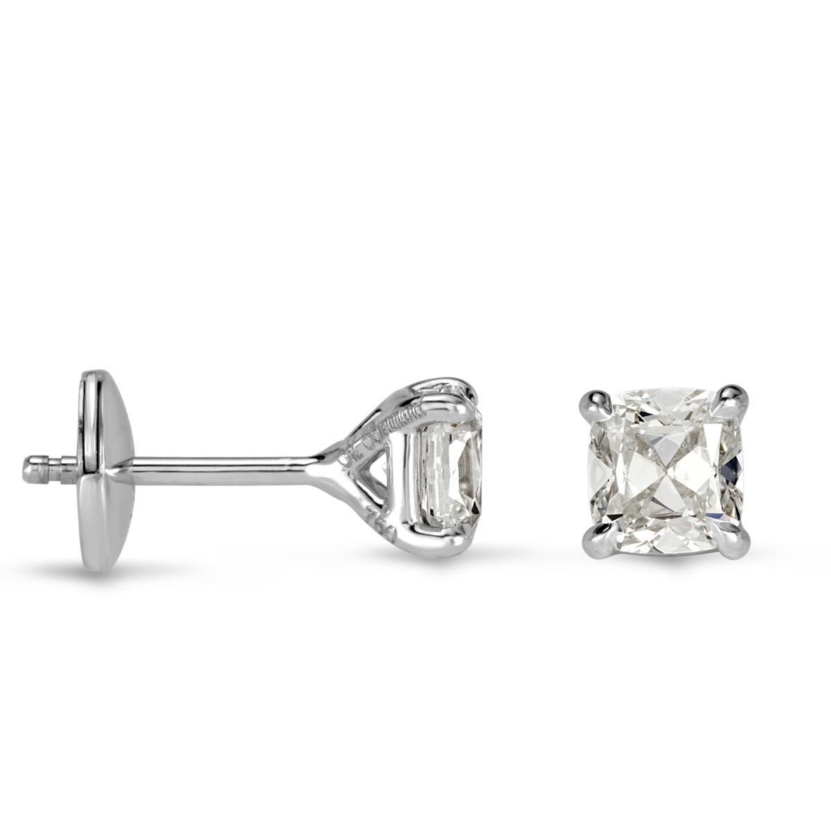 This gorgeous pair of old mine cut diamond stud earrings are glamorously chic. They showcase 1.00ct diamonds in total and are certified at F-G colors, VS1-VS2 clarities. They face up white and are perfectly eyeclean. They are handset on a feminine