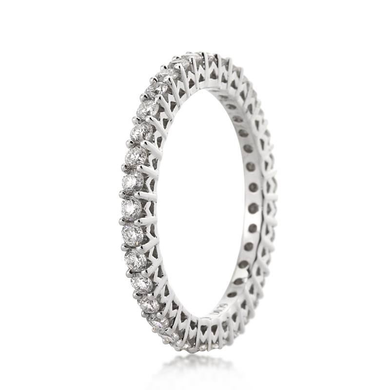 This classic diamond eternity band features 1.00ct of round brilliant cut diamonds graded at E-F, VS1-VS2. The colorless diamonds are exquisitely matched in this stunning 18k white gold setting. All eternity bands are shown in a size 6.5. We custom