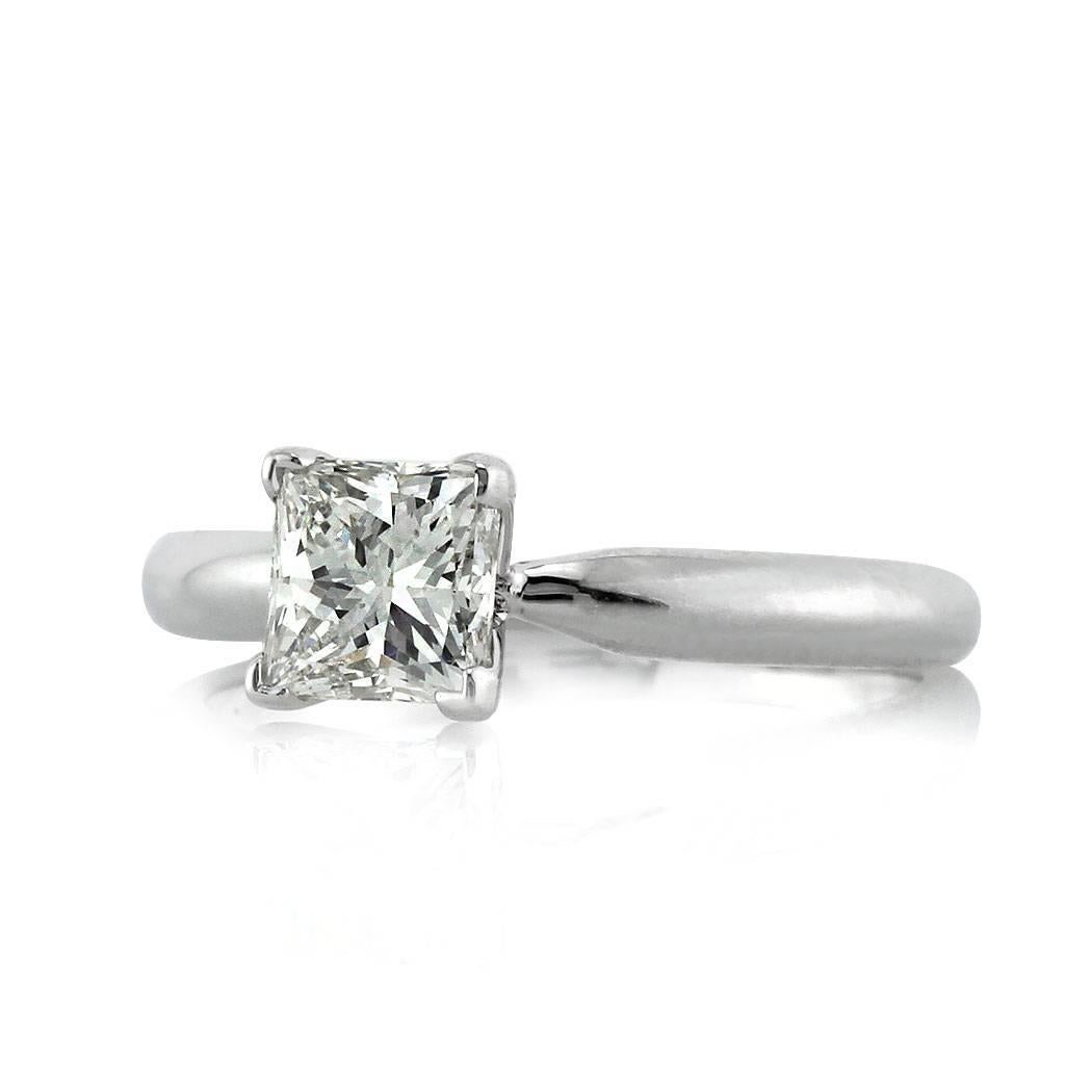 This elegant princess cut diamond solitaire engagement ring features a 1.00ct princess cut center diamond EGL certified at J-K, SI1. It is beautifully set in high polish 14k white gold.