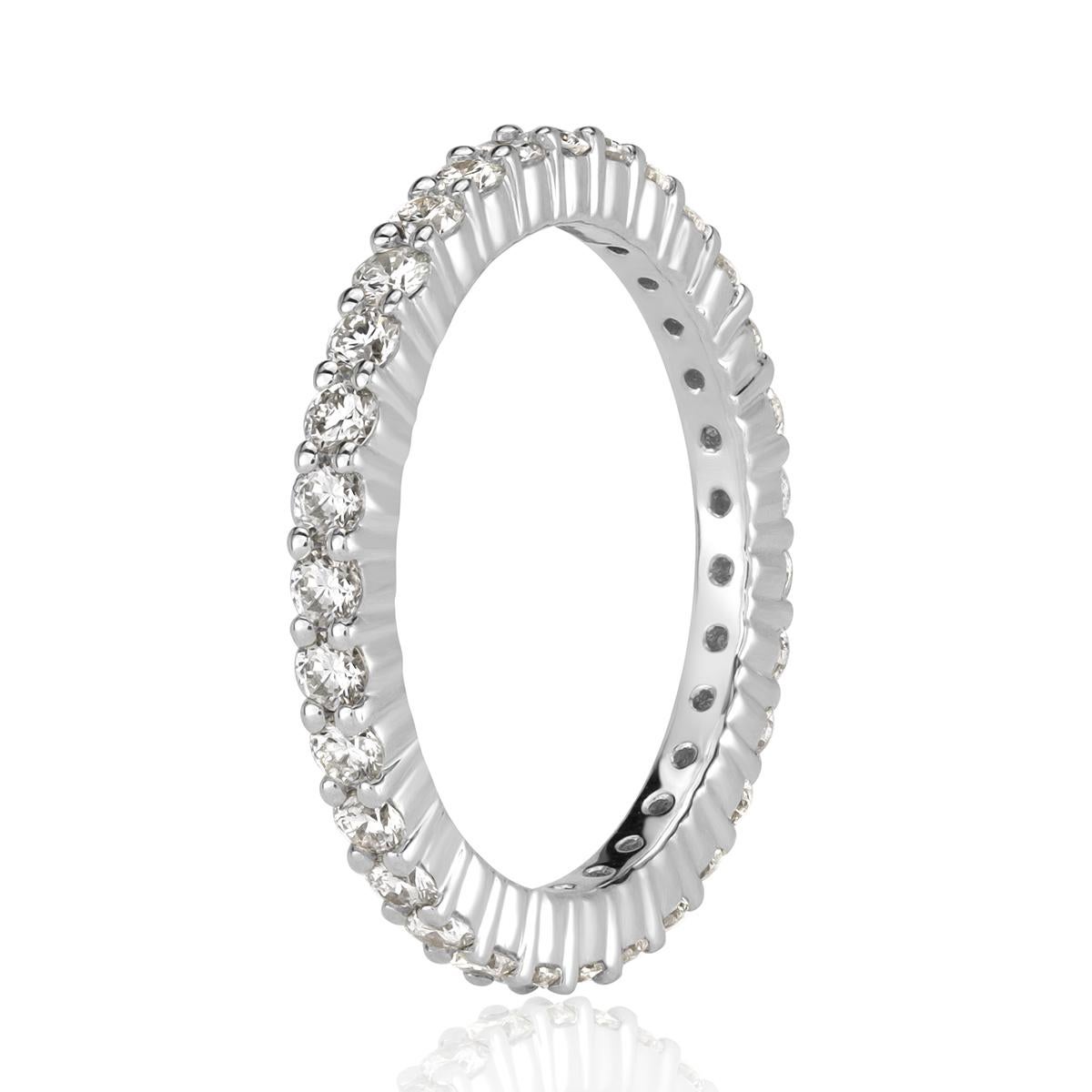 Custom created to perfection in 18k white gold, this stunning diamond eternity band showacses 1.00ct of round brilliant cut diamonds graded at E-F in color, VS1-VS2 in clarity. All eternity bands are shown in a size 6.5. We custom craft each