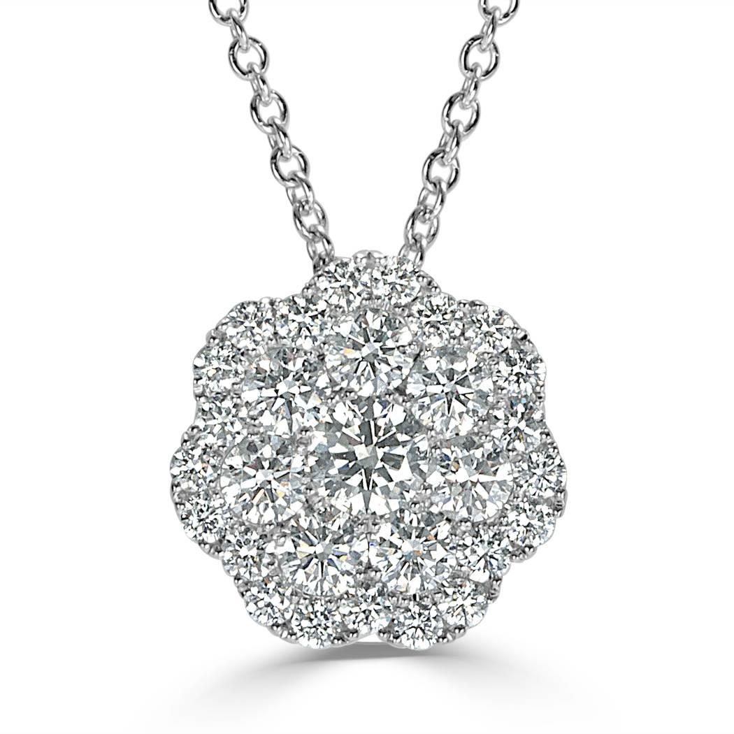 This exquisite flower cluster diamond pendant is set with 1.01ct of round brilliant cut diamonds graded at E-F, VS1-VS2. The diamonds are perfectly matched and hand set in 14k white gold.