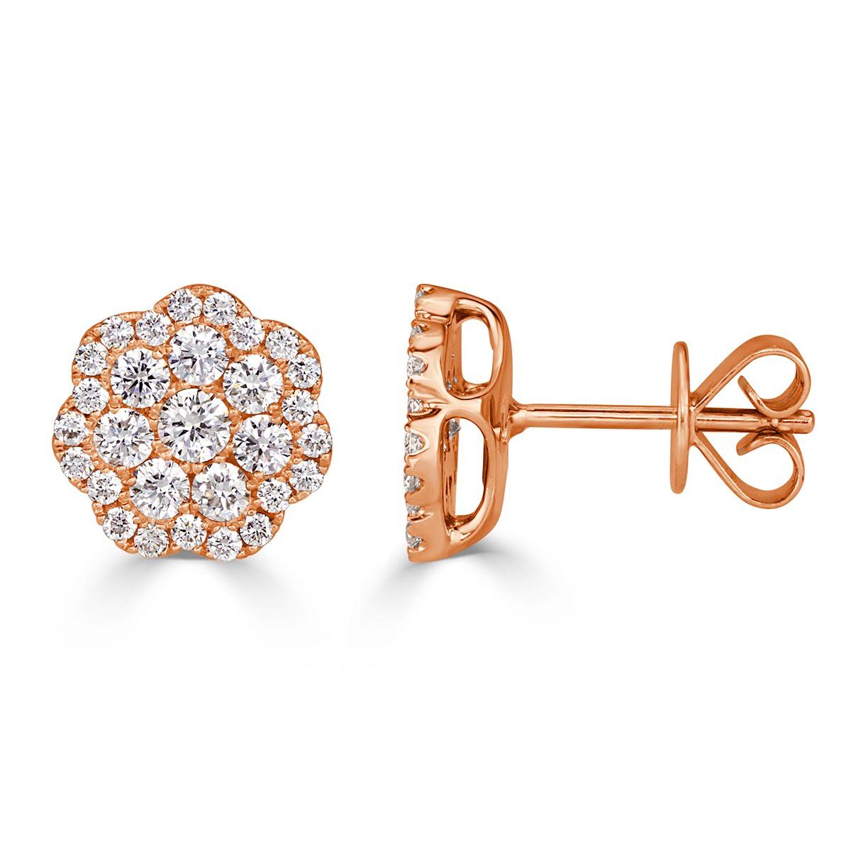 Custom created in 14k rose gold, this exquisite pair of diamond stud earrings features 1.03ct of impeccably matched round brilliant cut diamonds set in a lovely floral pattern. The diamonds are graded at E-F in color and VS1-VS2 in clarity. This