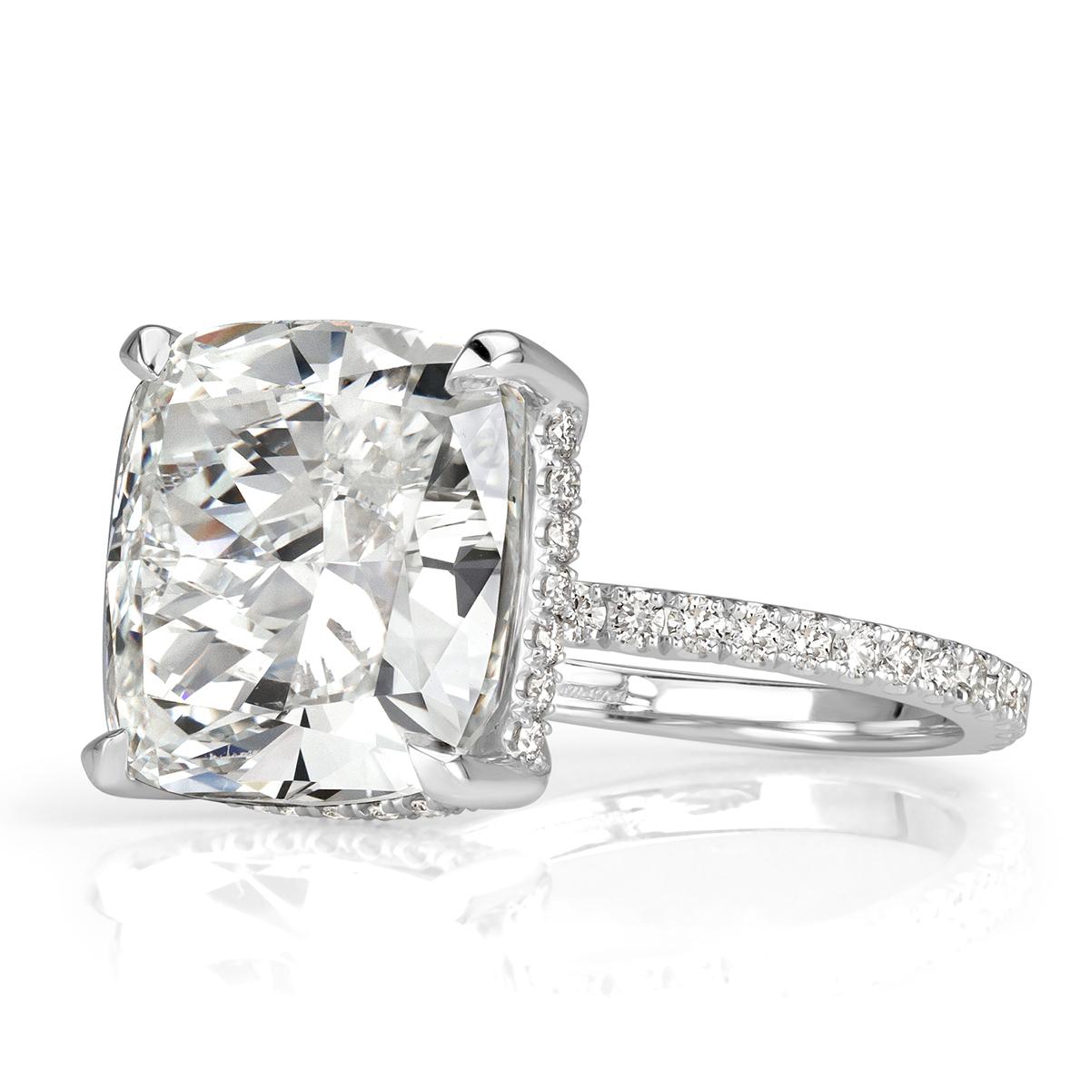 This fabulous diamond engagement ring showcases an exceptional 10.00ct cushion cut center diamond, GIA certified at G in color, VS1 in clarity. It faces up a crisp white and sparkles with tremendous brilliance. It is beautifully showcased in a