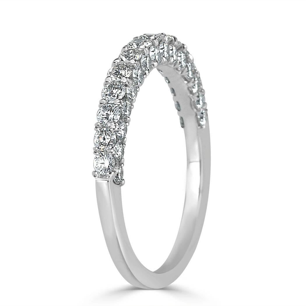 This beautiful diamond wedding band showcases 1.15ct of round brilliant cut diamonds on all three sides set in an eternal micro pavé style. The diamonds are graded at E-F, VS1-VS2 and hand set in 18k white gold.