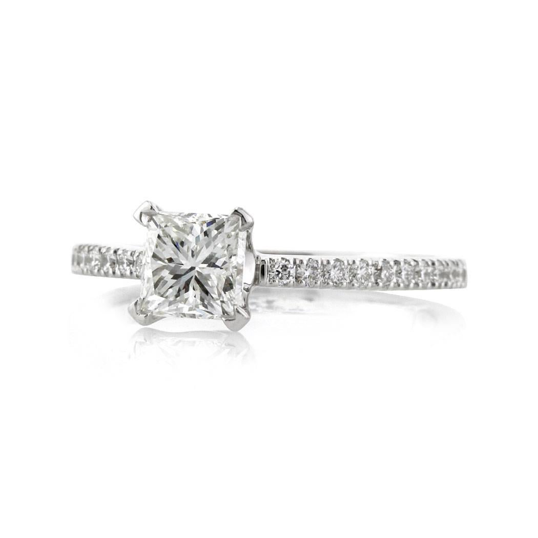 This beautiful diamond engagement ring features a lovely 0.93ct princess cut center diamond, GIA certified at G-VS1. It is set in high polish 18k white gold and accented by 0.25ct of round brilliant cut diamonds micro pavé set around the shank. 