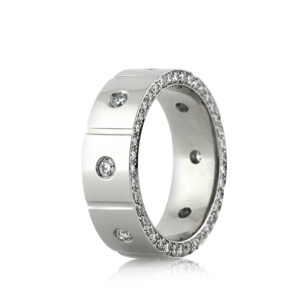 Created in platinum, this diamond eternity band features a 6mm width and showcases 1.20ct of round brilliant cut diamonds set in a flush setting on top and accented by a row of round diamonds micro pavé set on the front and the back of the ring. All