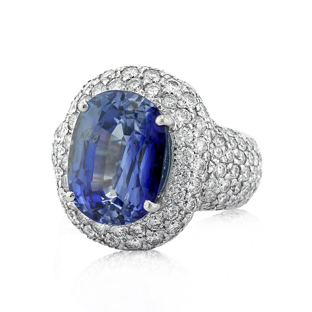 This Ceylon sapphire and diamond estate ring features a superb 11.19ct oval cut natural blue sapphire, AGL certified unheated. For added brilliance it is accented by numerous round brilliant cut diamonds set in a domed, full pave halo and a stunning