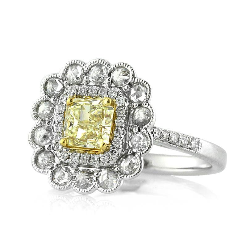 This captivating diamond engagement ring features a lovely 0.81ct radiant cut center diamond, EGL certified at Fancy Intense Yellow-VS2. It is complimented by a micro pavé halo as well as another row of larger round brilliant cut diamonds bezel set
