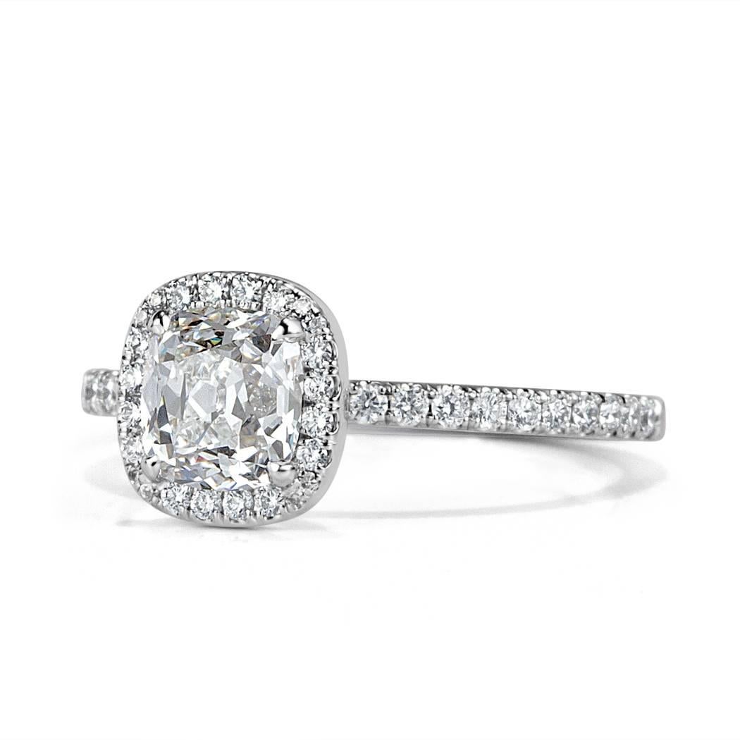 This unique diamond engagement ring is set with a beautiful 1.03ct old Mine cut center diamond, GIA certified at F-SI1. It is accented by 0.30ct of shimmering micro pavé set diamonds graded at E-F, VS1-VS2. 