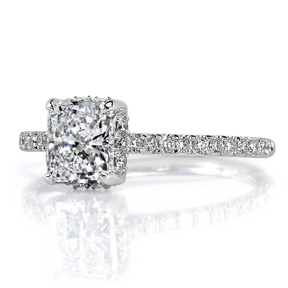 Custom created in platinum, this enchanting diamond engagement ring showcases a stunning 1.00ct radiant cut center diamond, GIA certified at D-VS1. It is accented by one row of round brilliant cut diamonds micro pavé set around the shank. The accent