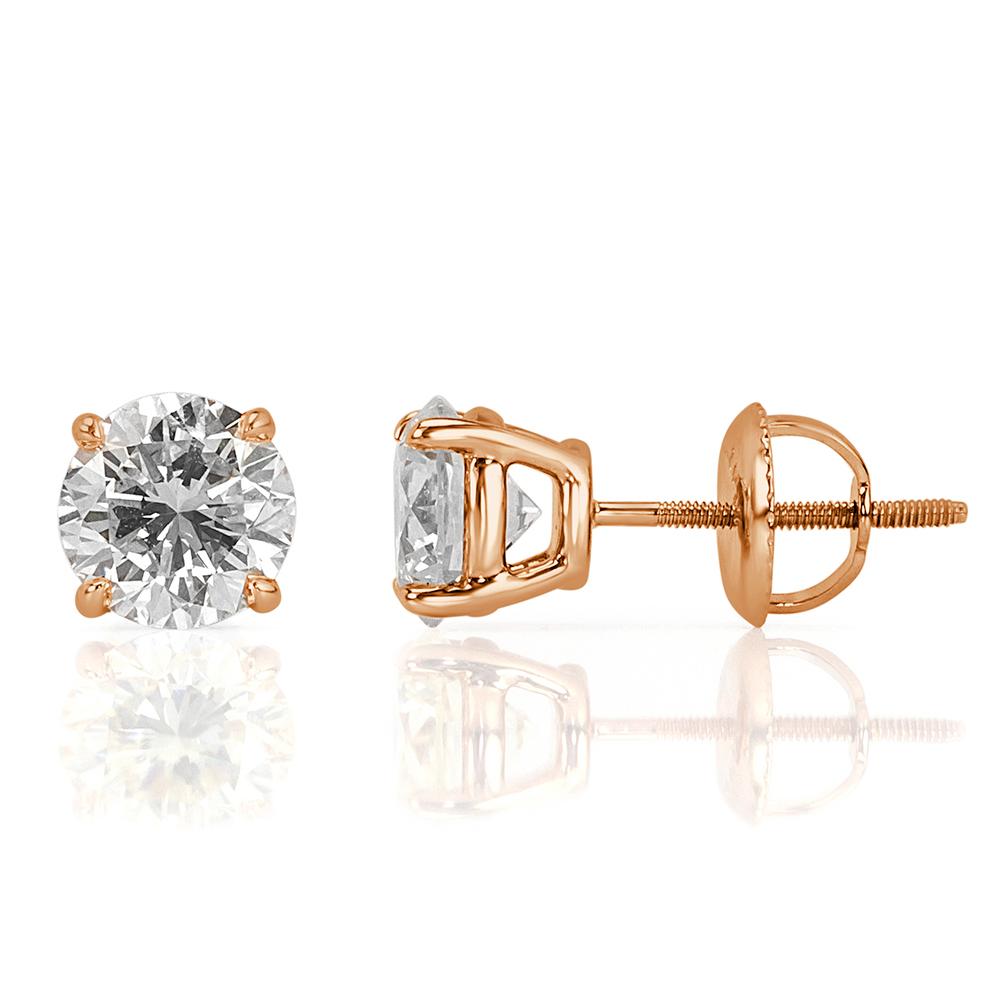 This stunning pair of diamond stud earrings showcases two gorgeous round brilliant cut diamonds, GIA certified at I in color, VS2 in clarity. They display immense brilliance due to their triple excellent grading in polish, symmetry and cut. They are