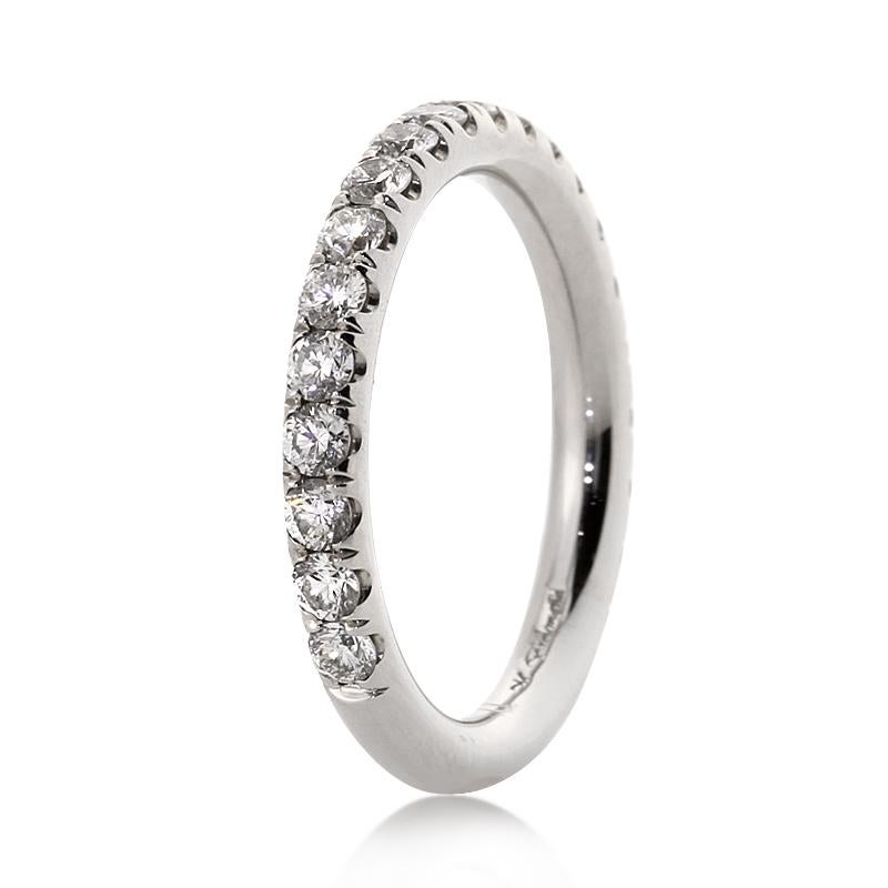 Handcrafted in high polish platinum, this exquisite diamond wedding band showcases 1.35ct of round brilliant cut diamonds graded at E-F in color, VS1-VS2 in clarity. 