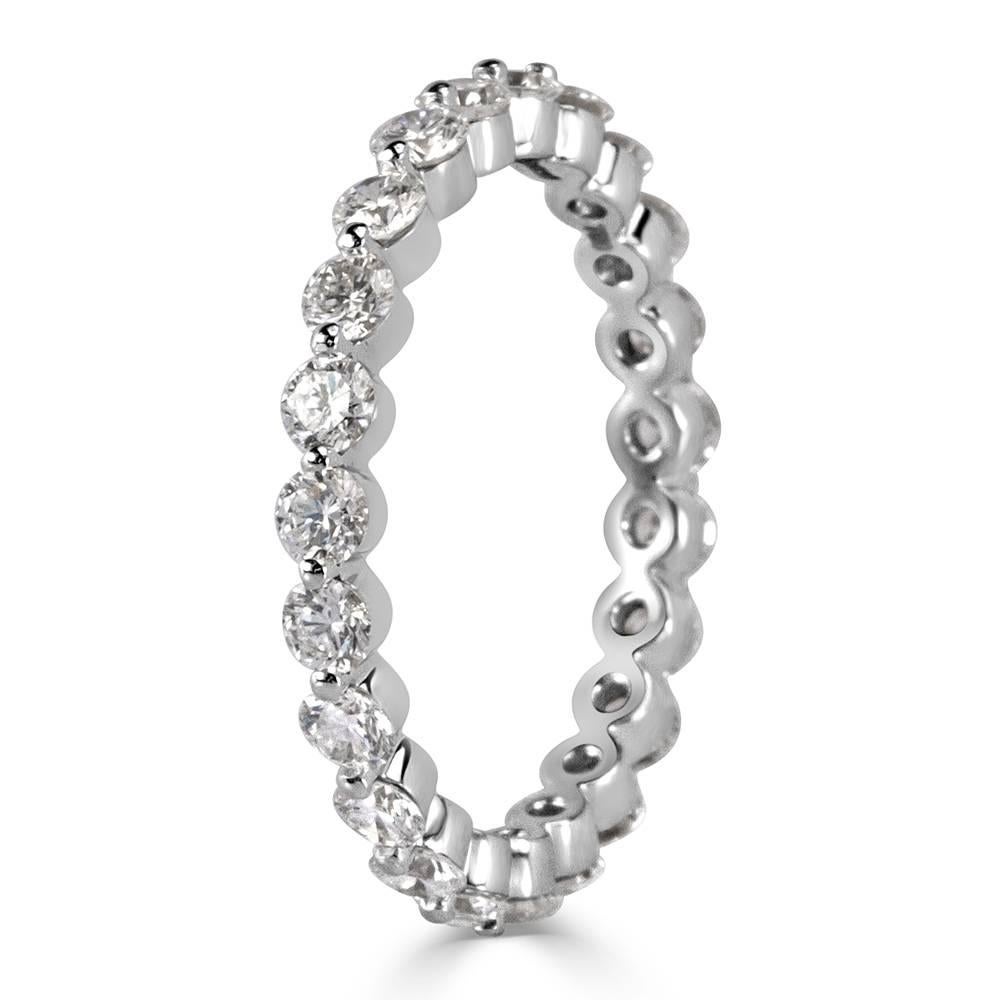 Created in 18k white gold, this stunning diamond eternity band showcases 1.40ct of round brilliant cut diamonds individually set with a single prong for maximum sparkle. The diamonds are graded at E-F in color, VS1-VS2 in clarity.