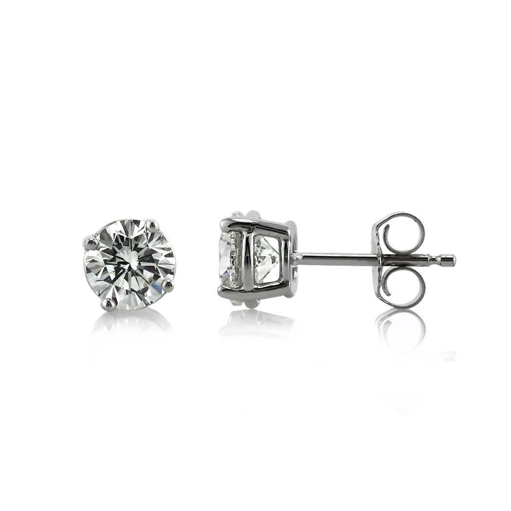 These beautiful pair of diamond stud earrings features two round brilliant cut diamonds with a total weight of 1.41ct and EGL certified at G-H, SI1. These matching diamonds are set on high polish, 14k white gold posts with butterfly backs.