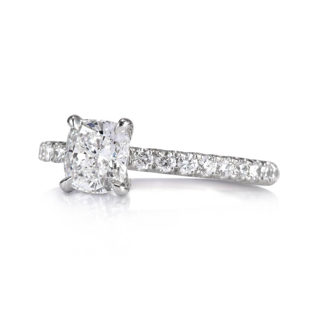 This gorgeous diamond engagement ring showcases a beautiful 1.05ct cushion cut center diamond, GIA certified at G-VVS1. It is accented by a delicate platinum shank featuring 0.40ct of round brilliant cut diamonds graded at F-G, VS1-VS2. They are