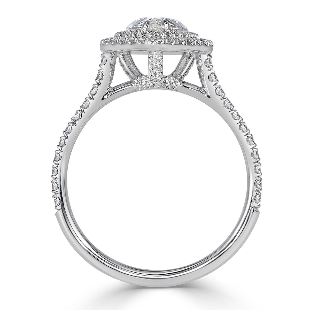 This mesmerizing pear shaped diamond engagement ring showcases an exquisite 1.06ct pear shaped center diamond, GIA certified at D-SI2. It is accented by a double halo of round brilliant cut diamonds as well as one row of shimmering diamonds micro