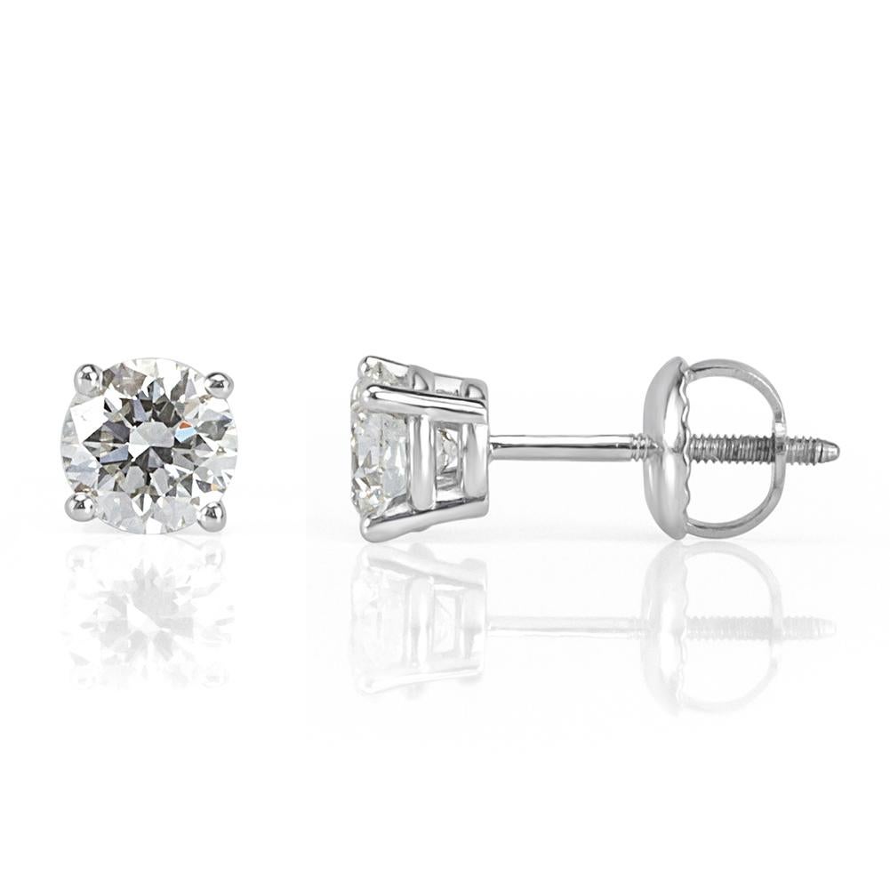 This ravishing pair of diamond stud earrings showcases two round brilliant cut diamonds with a total weight of 1.62ct. They are both GIA certified at I, VS1-VS2 and set in a classic four prong, 18k white gold setting with screw backs for added
