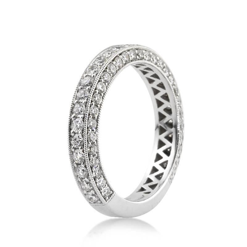 This gorgeous diamond wedding band features three rows of round brilliant cut diamonds pavé set on all three sides of this custom, 18k white gold setting. The diamonds total 1.65ct in weight and are set at about three quarters of the band. They are