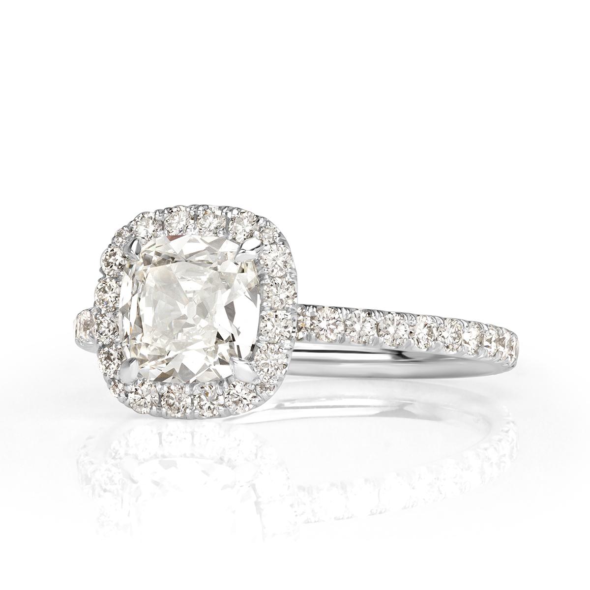 Custom created in platinum, this ravishing diamond engagement ring features a gorgeous 1.05ct old Mine cut center diamond, GIA certified at H in color, VS1 in clarity. It faces up peerless white, perfectly clear and has a tremendously beautiful cut.